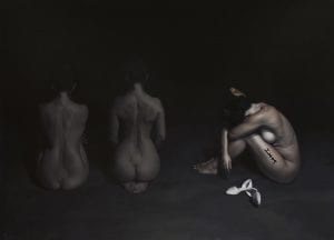 A painting of three nude women. Two face away from the viewer, while another is shown in profile with her head between her knees.