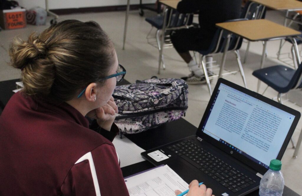 Student journalist working on her computer