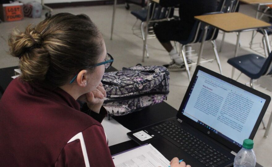 Student journalist working on her computer