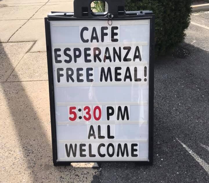 Sign outside of Cafe Esperanza says, "All are Welcome."
