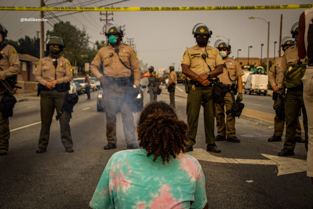 Dijon Kizzee protester in front of a line of LA Sheriff Deputies [Photo credit: Michael Ade]