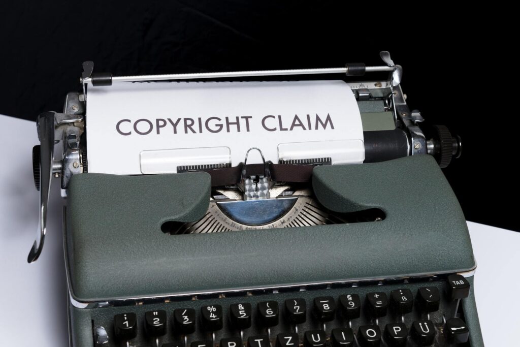Typwriter with paper that says "copyright claim"