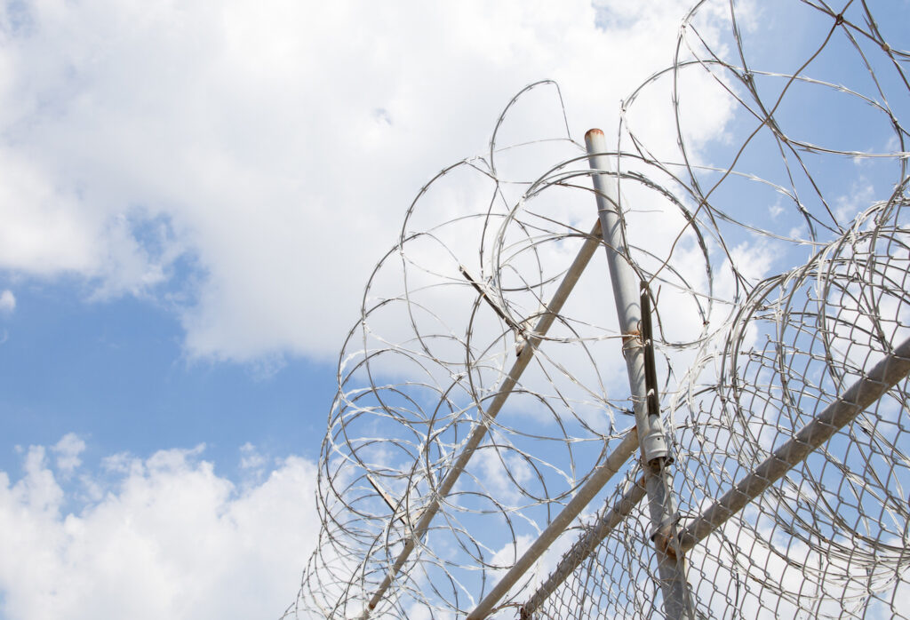 Razor wire fence surrounding a prison