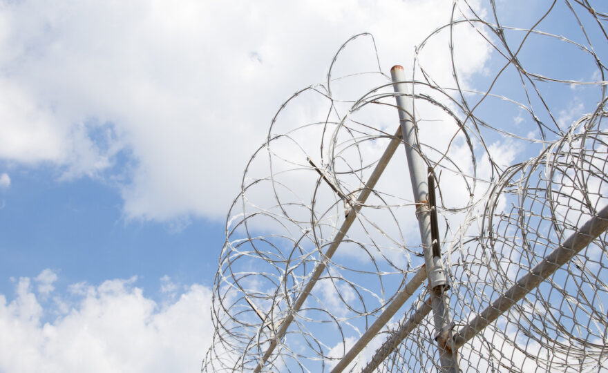 Razor wire fence surrounding a prison
