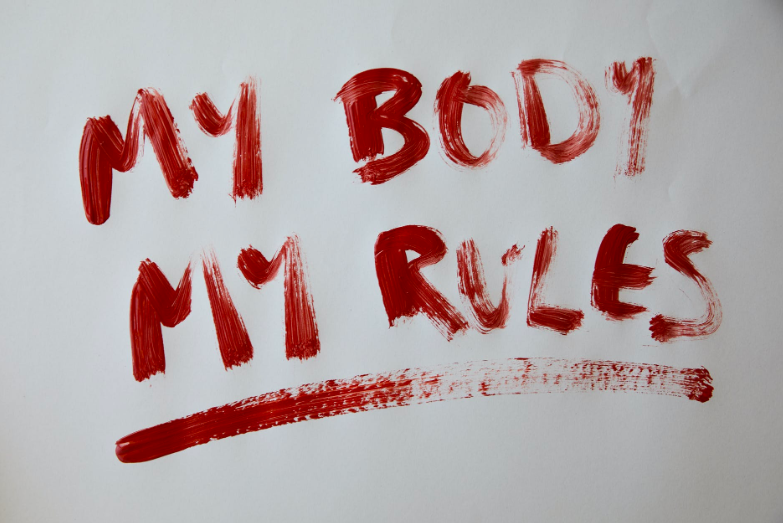 Red text on gray background that reads, "My Body, My Rules."