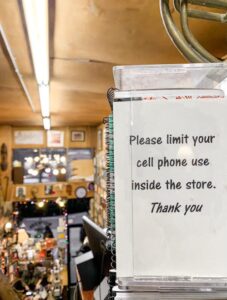 Signs throughout the store urge customers to read more and talk less. [Credit: Esmeralda Baez]