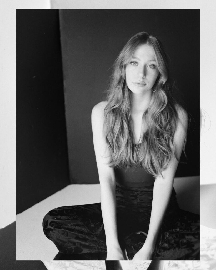 Model and influencer, Madeline Ford sitting.
