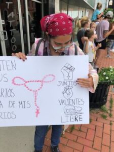 Cazares-Martinez displays her sign