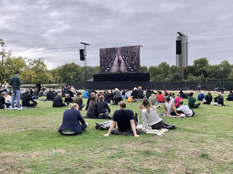 Spectators gather to watch the Queen's funeral on screen