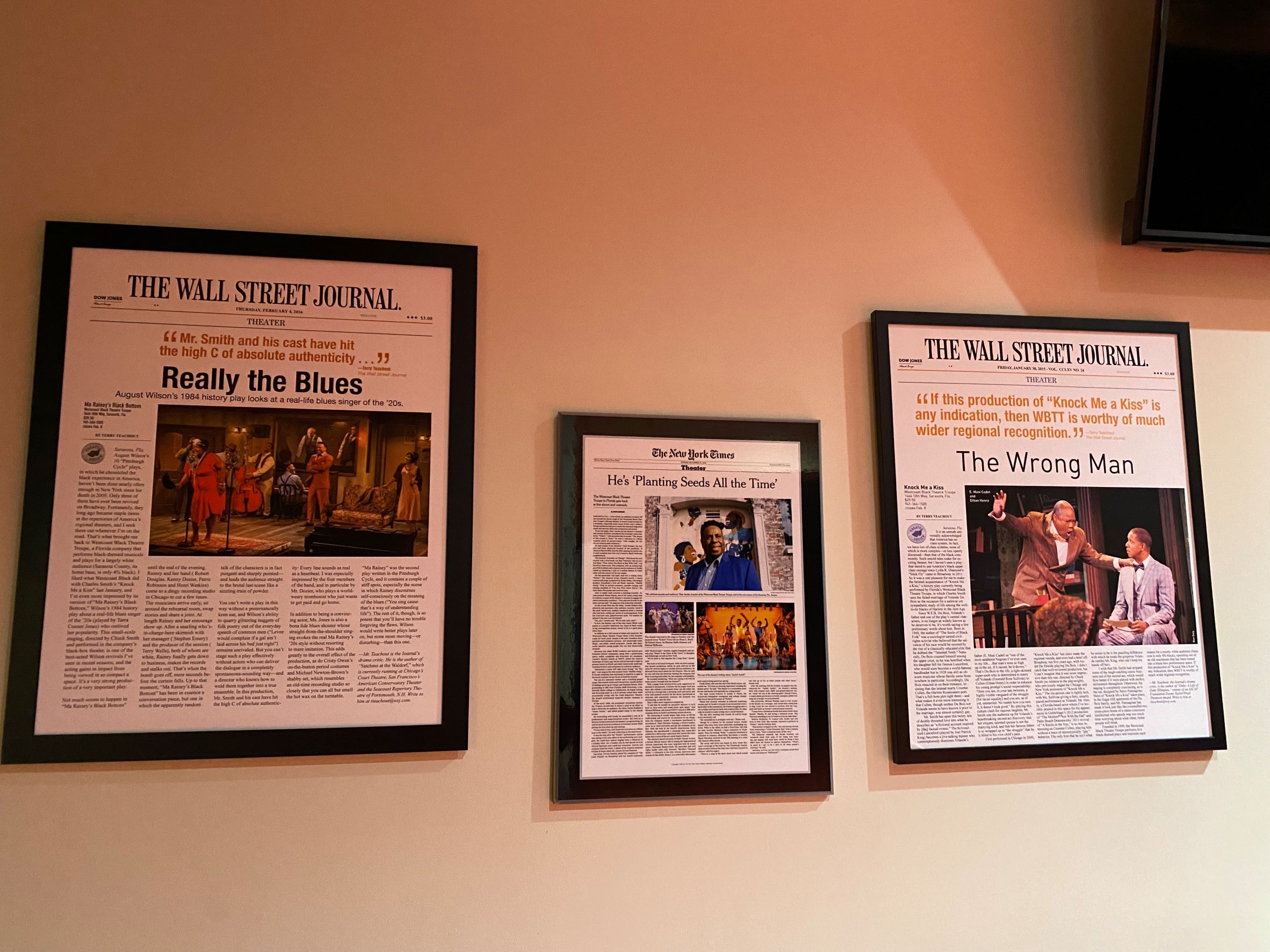 Three framed articles are on the wall in the lobby of the WBTT.