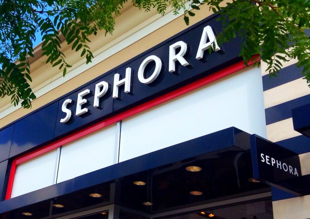 black and white sign reads "Sephora" at storefront.
