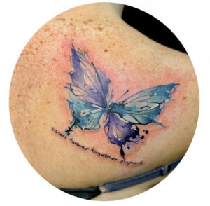 Butterfly tattoo with quote.