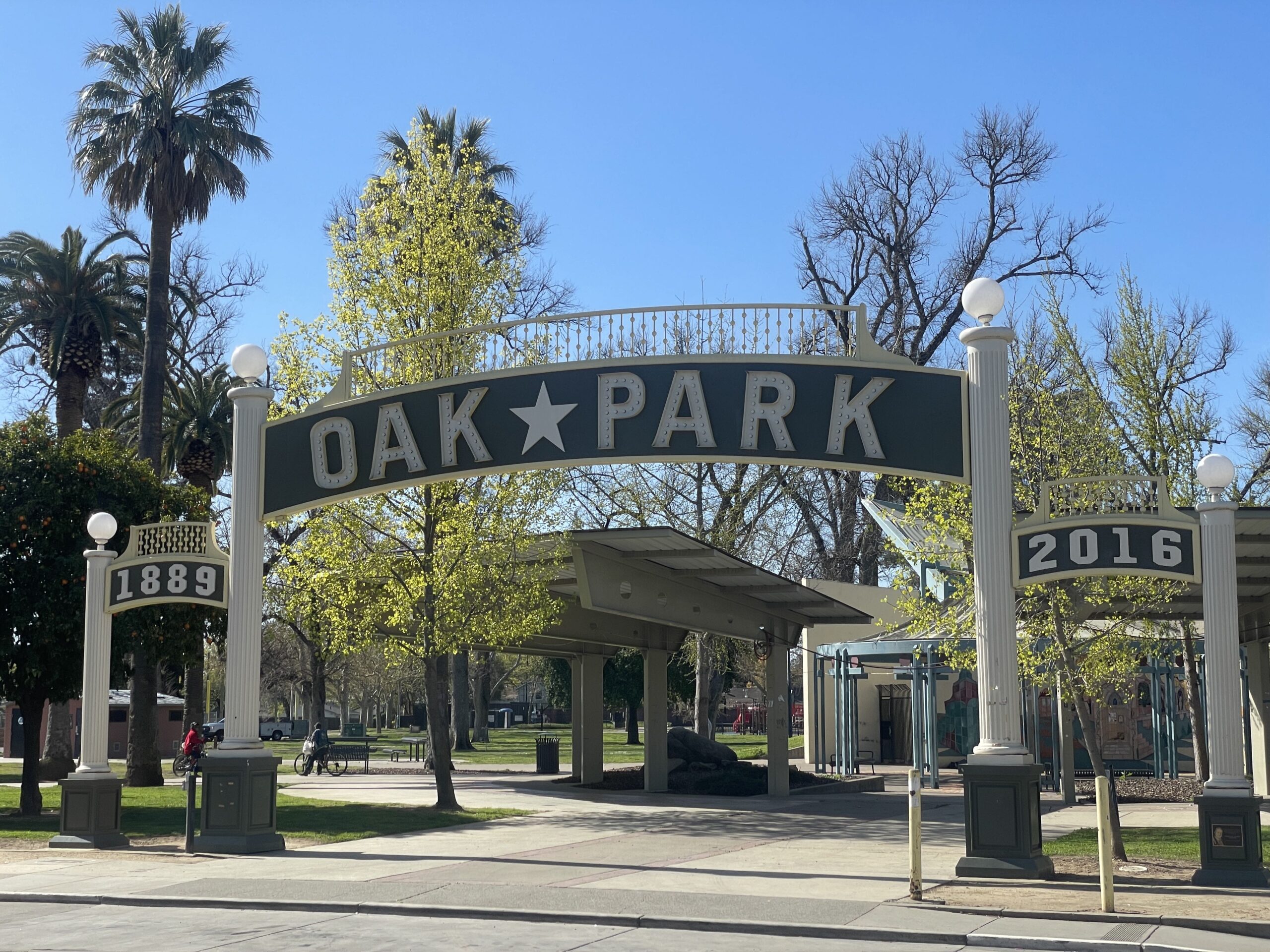 oak park sign surrounded by trees on a sunny day