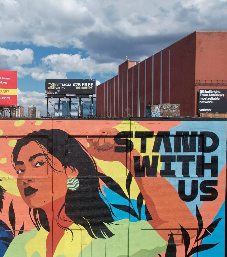 Mural that says "Stand with Us"