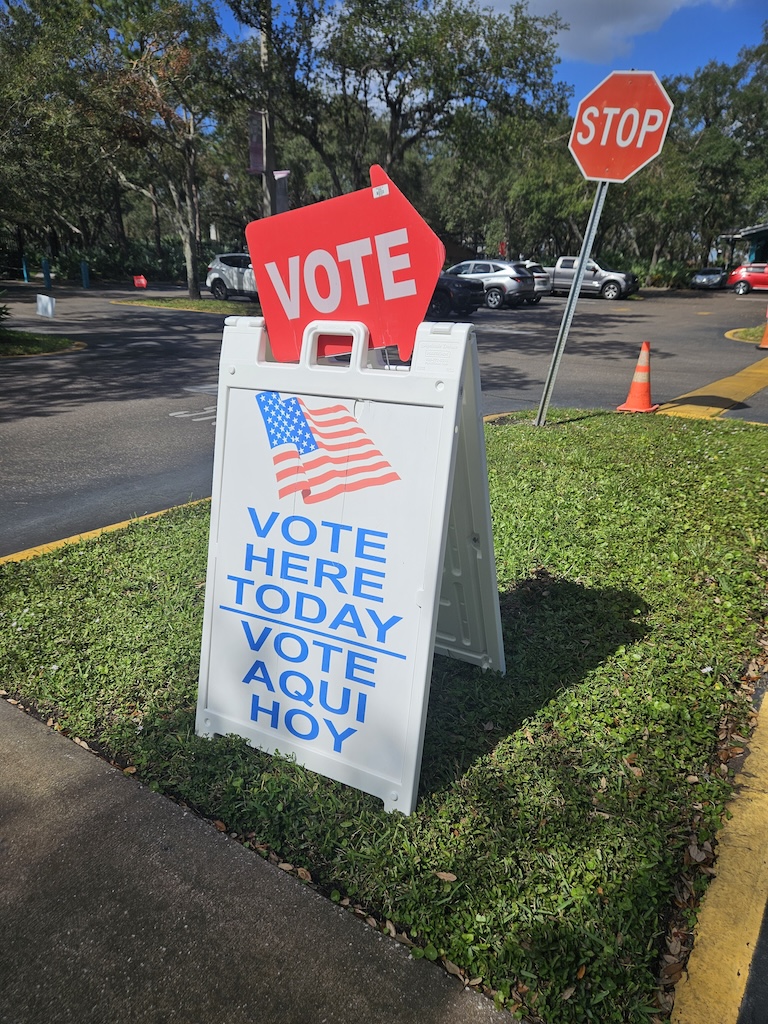 Sign saying "Vote Here Today"