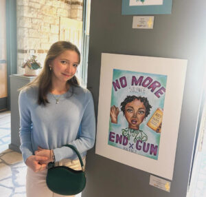 Serena Ray is shown with her artwork in Austin, Texas. [Credit: Serena Ray]