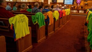 A Vidas Robadas t-shirt installation is shown in a Texas church. [Credit: Bobby Watson]