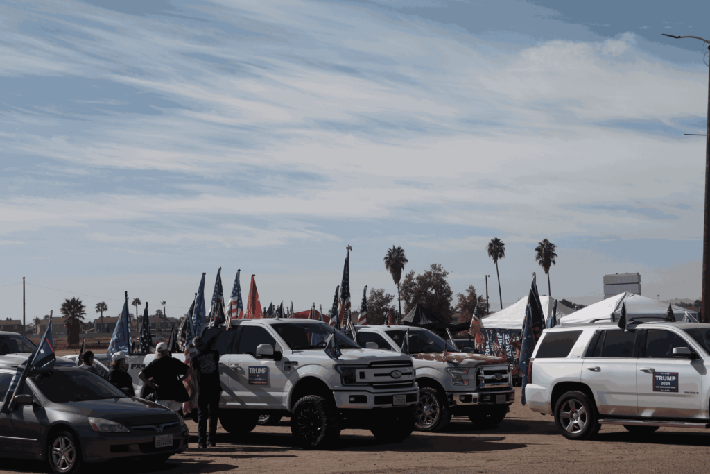 Trumps supporters and cars loaded with MAGA flag at a rally in Riverside.