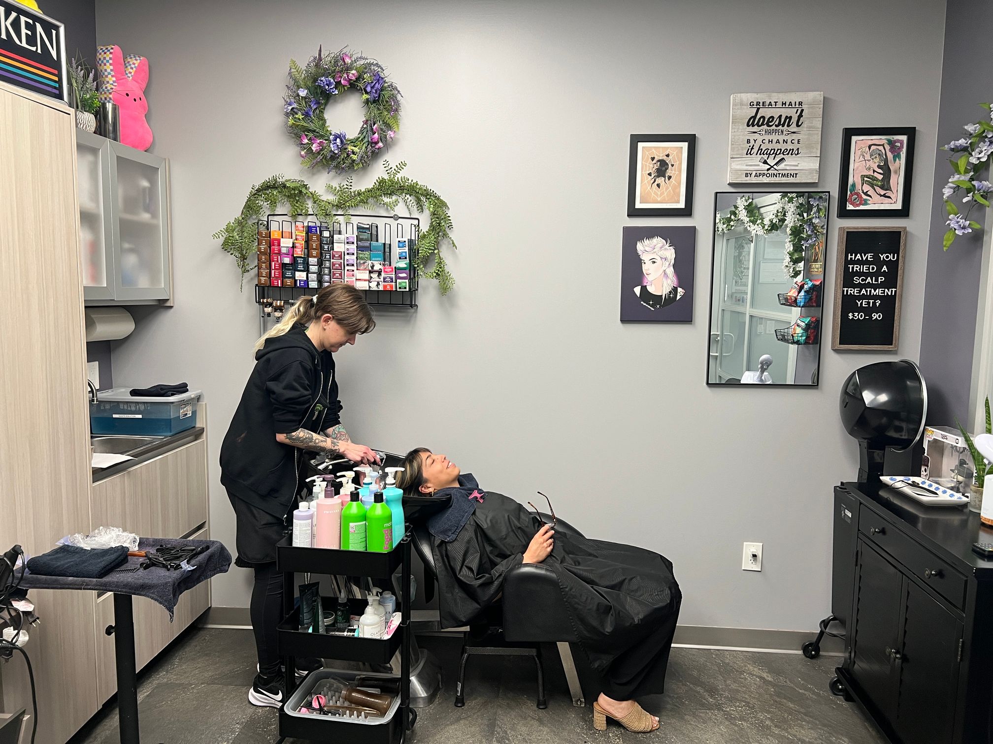 Celeste washing client's hair.