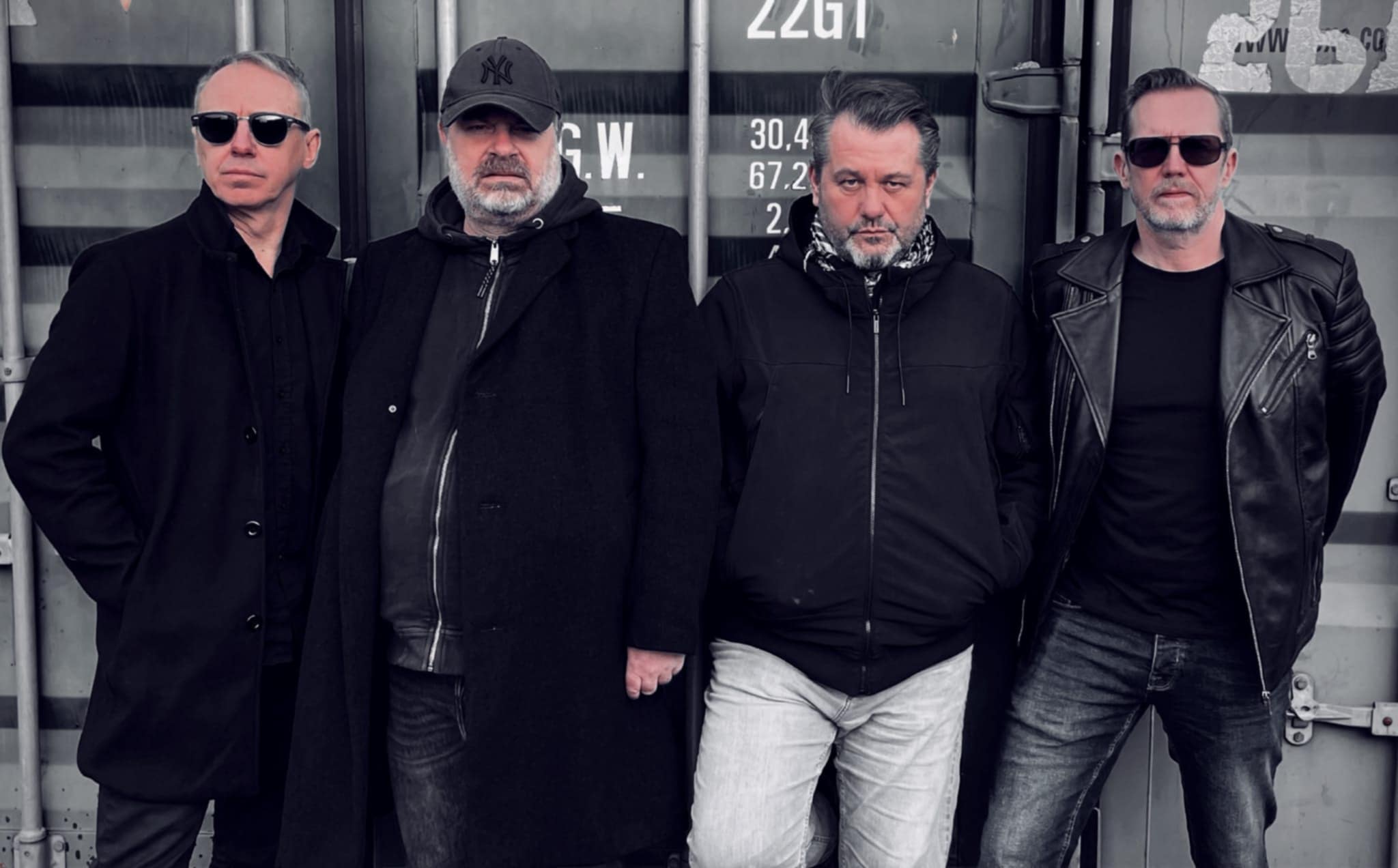 The Sway members are standing, posing for a photo.