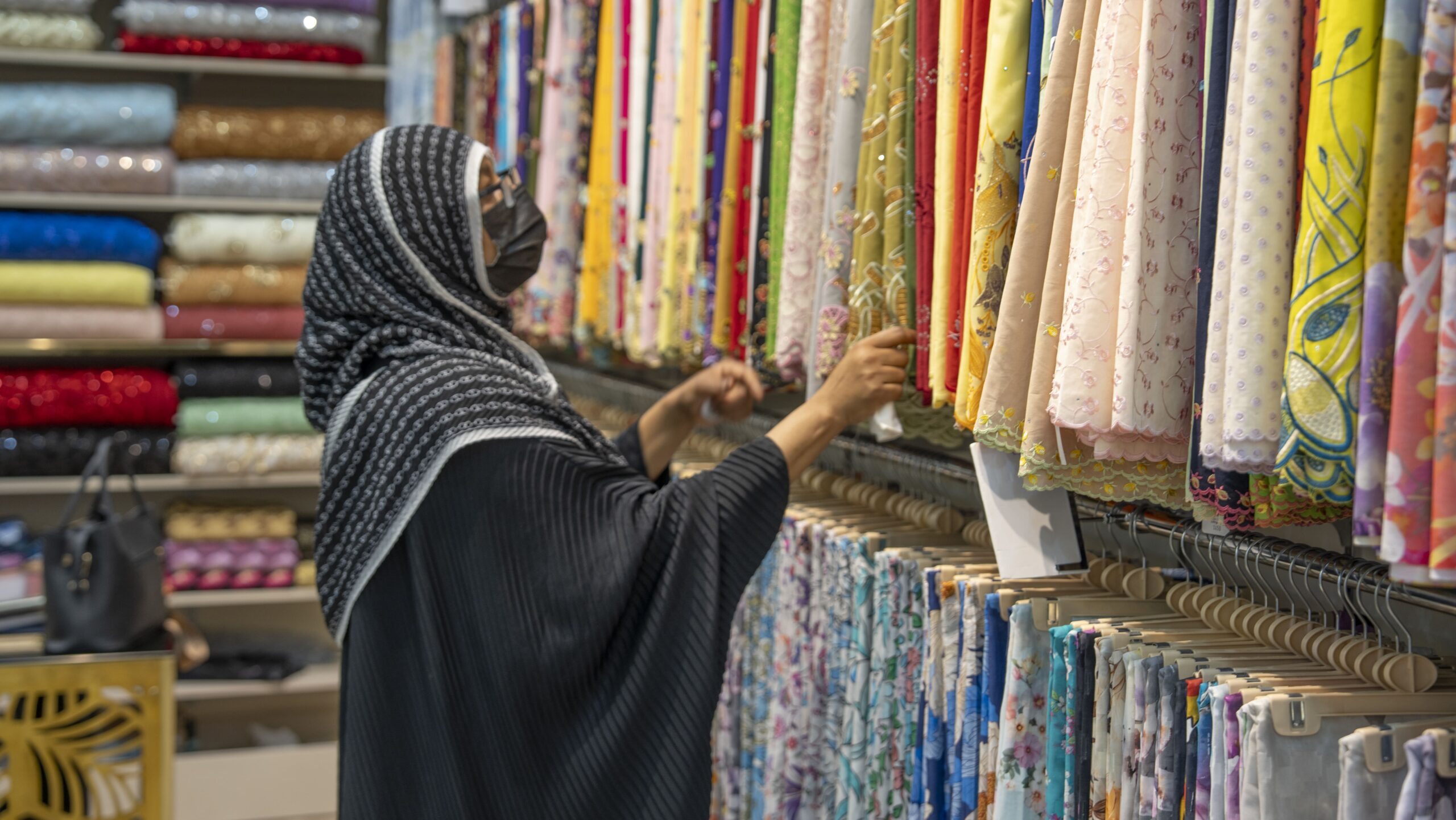 lady looking at fabrics