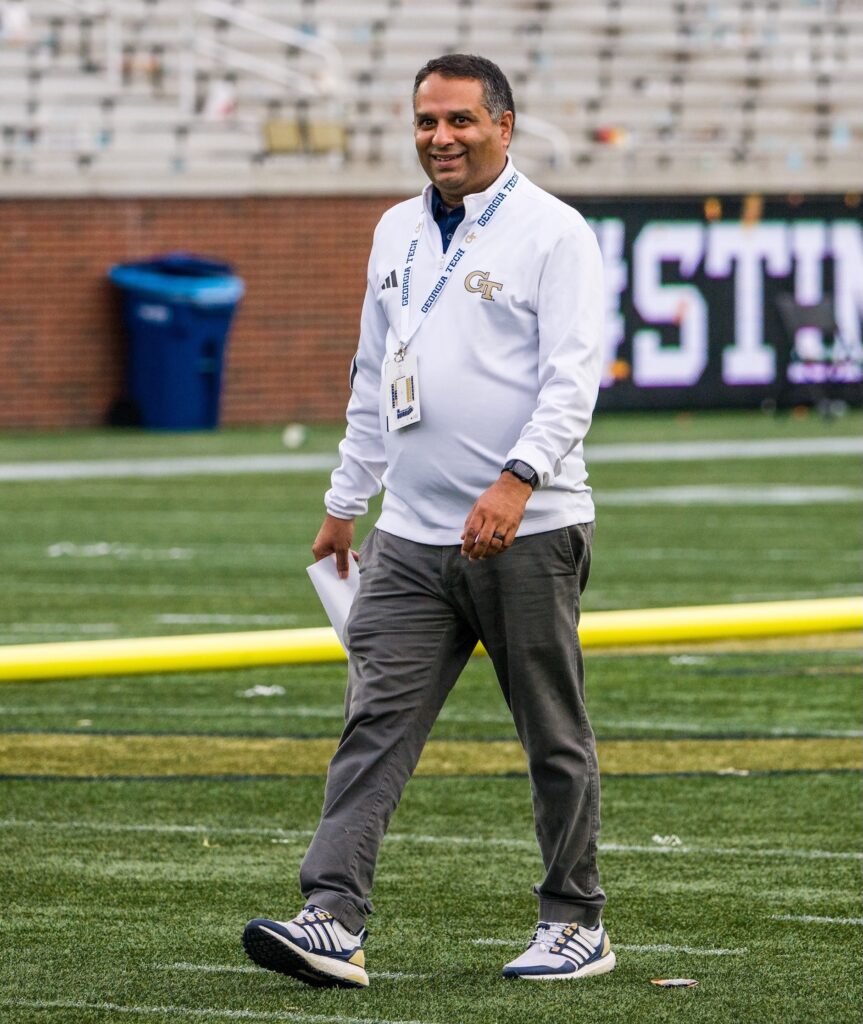 Man walking on football field