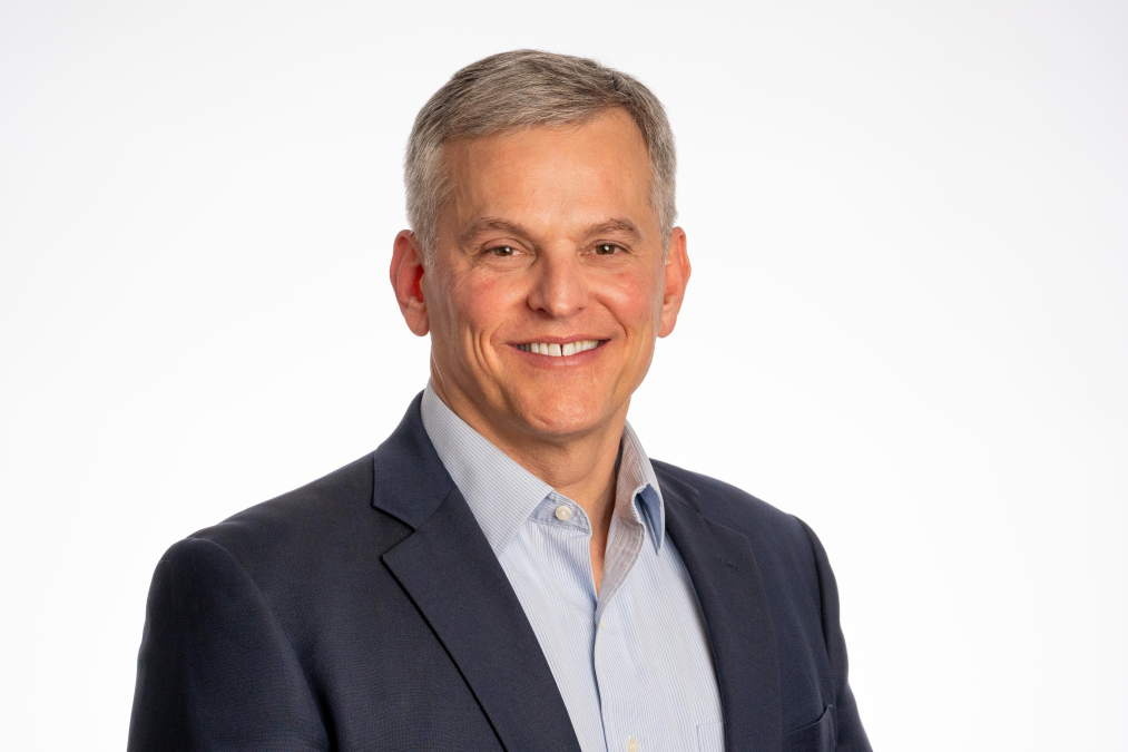 Headshot of Josh Stein wearing a suit jacket and collared shirt