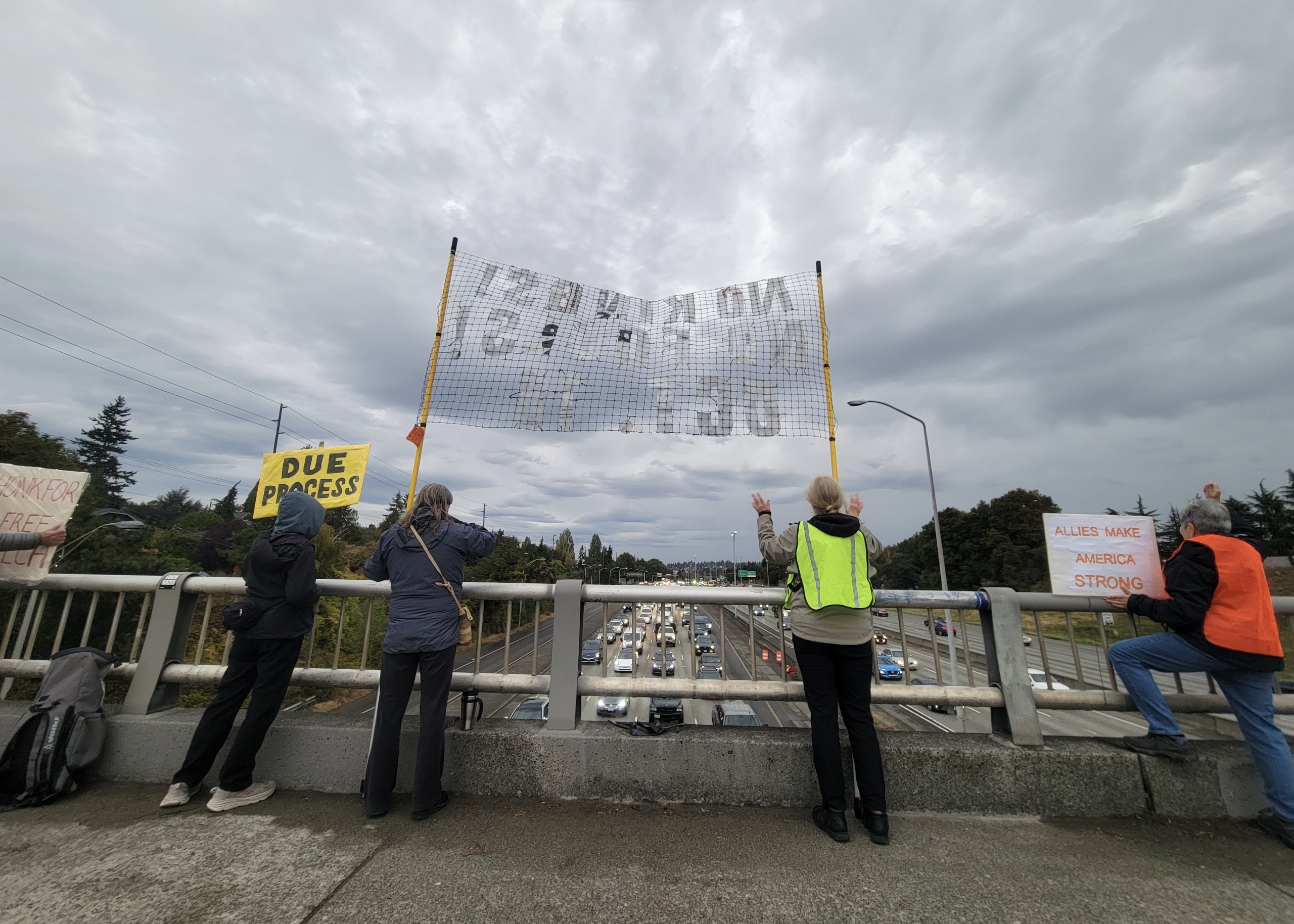 Image for ‘I Can’t Not Be Out Here:’ Seattle Protesters Explain Why They Stand on Overpasses Protesting the Trump Administration
