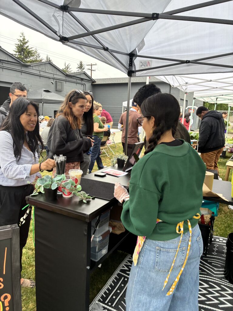 Man and woman serve drinks to customers