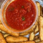Mozzarella sticks with homemade basil and marinara sauce. By: Bria Davis