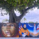 Artist Arturo Salazar contributed two murals. "The first one is a Native Mexican girl. ... It comes from Seri community ... Seri is a tribe from Mexico," he explained. "It is a little like, very sad, a very sad girl that I painted like that because ... it's a very poor town."
His second contribution was a mural of Mexican American astronaut José M. Hernández, who was "a model for motivation, especially for younger people to think about ... His parents used to take him to work in the fields, picking tomatoes, picking peppers, and some vegetables ... One day he said I'm going to be an astronaut. And he got it. He worked hard in order to make it, in order to be an astronaut. And that is why I say that he is an example, a great example of motivation." Arturo Salazar's mural