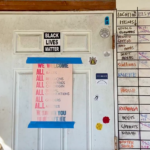 Social justice-related signs at Vibrant Valley Farm.