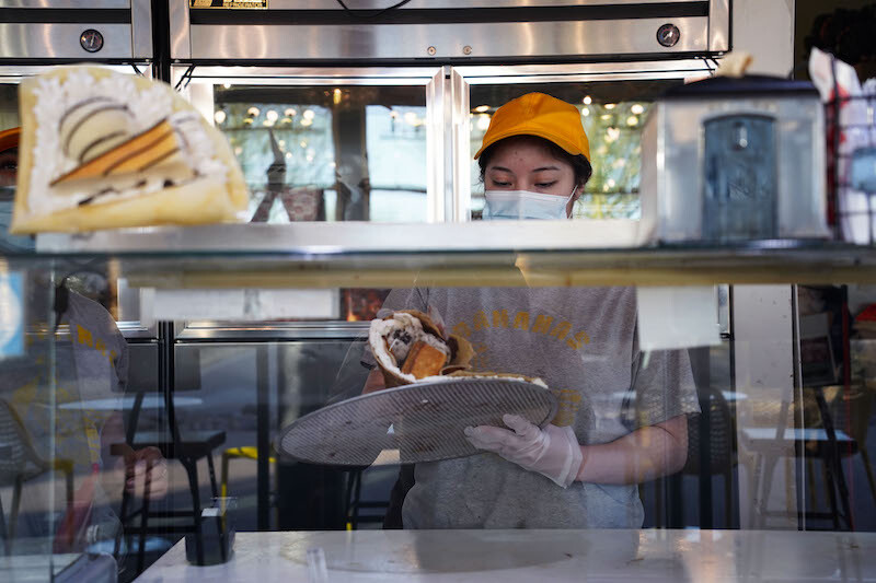 Abigail Vega makes crepe dessert at Hana Banana, a local dessert spot, in El Paso, Texas, March 10, 2022.