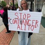 One woman holds a sign saying "stop coathanger alito"