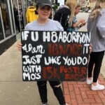 Woman holds pro-choice sign