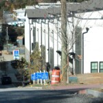 An image showcasing signs advertising the new complex and its great amenities, [An image showcasing